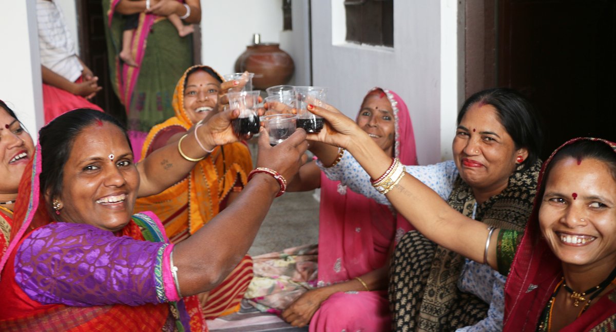 Some of Anchal's artisans celebrating the arrival of the Anchal team by welcoming them into their own homes