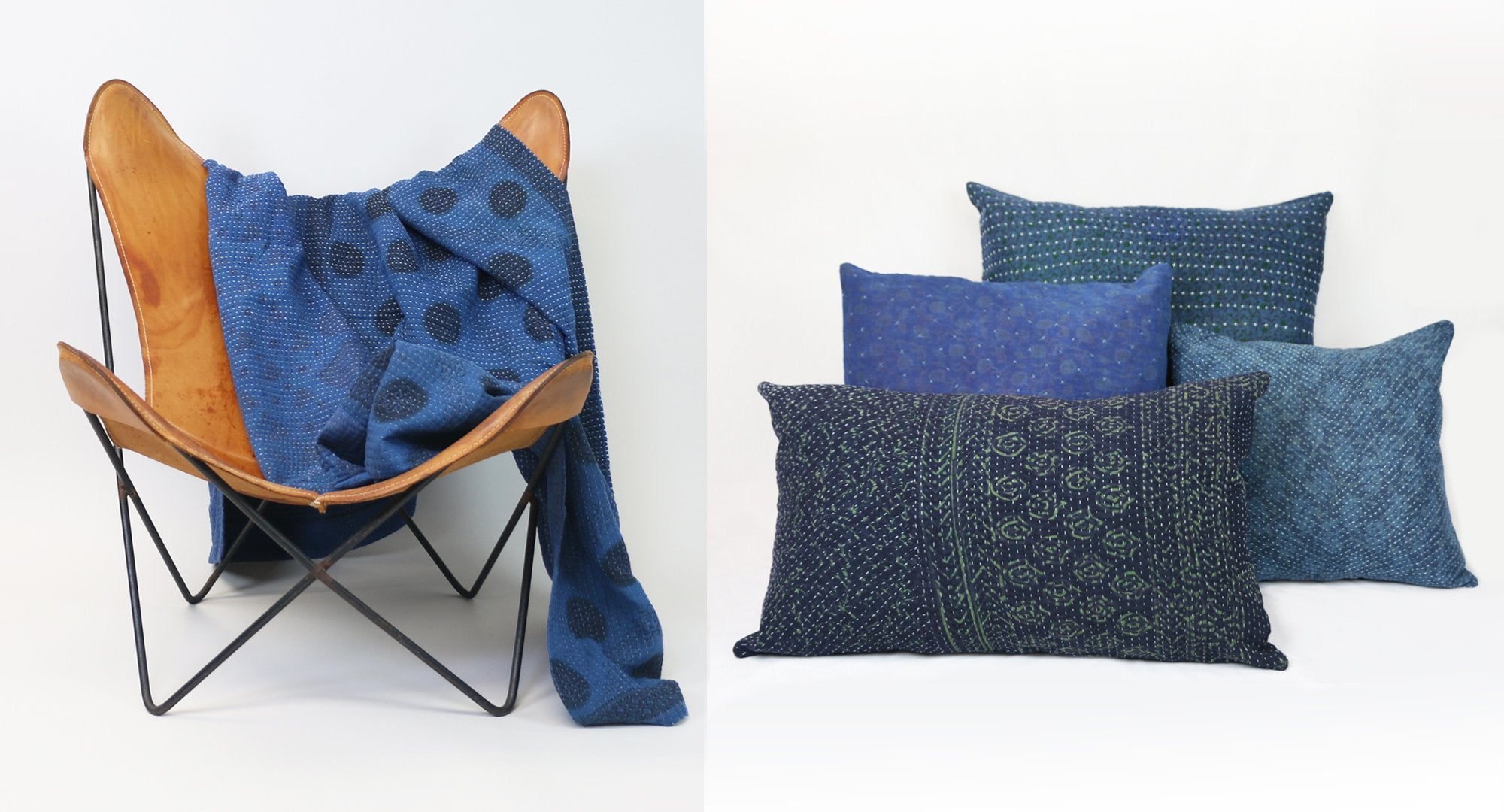 Anchal's naturally dyed indigo throw draped over a chair and four naturally dyed indigo pillows