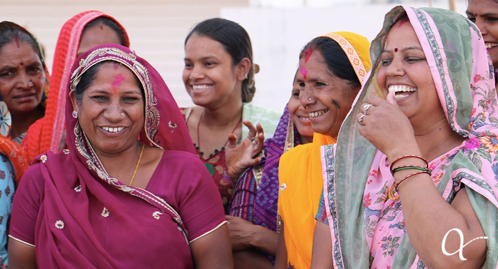 Group of artisan women joyfully laughing and smiling