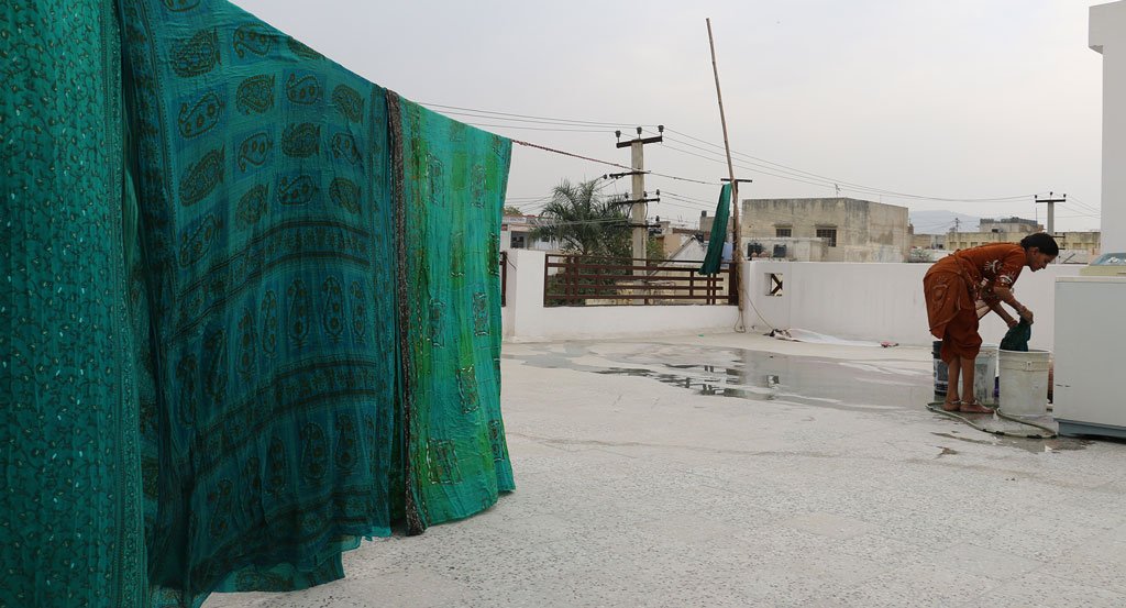 Vintage dyed fabrics hanging to dry outside