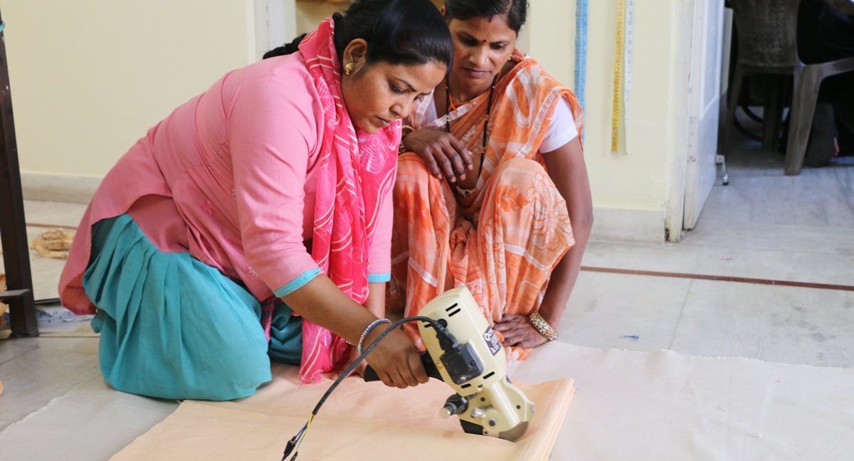 Anchal artisans using the new electric fabric cutter provided to them from incredible fundraising support