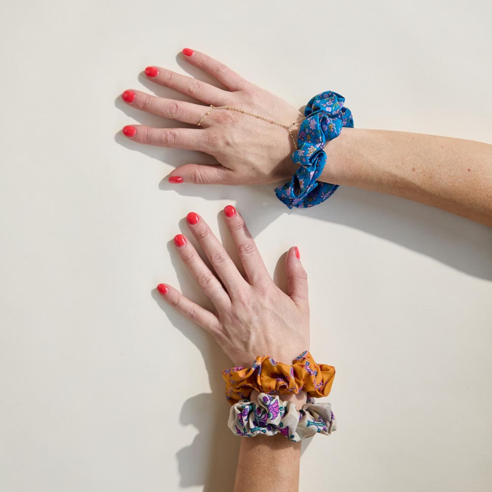 colorful silk scrunchies on woman's wrist