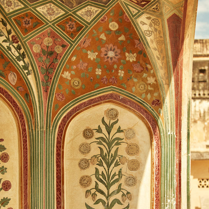 beautiful hand painted floral tile work on a wall in Rambagh, Palace in Jaipur, India