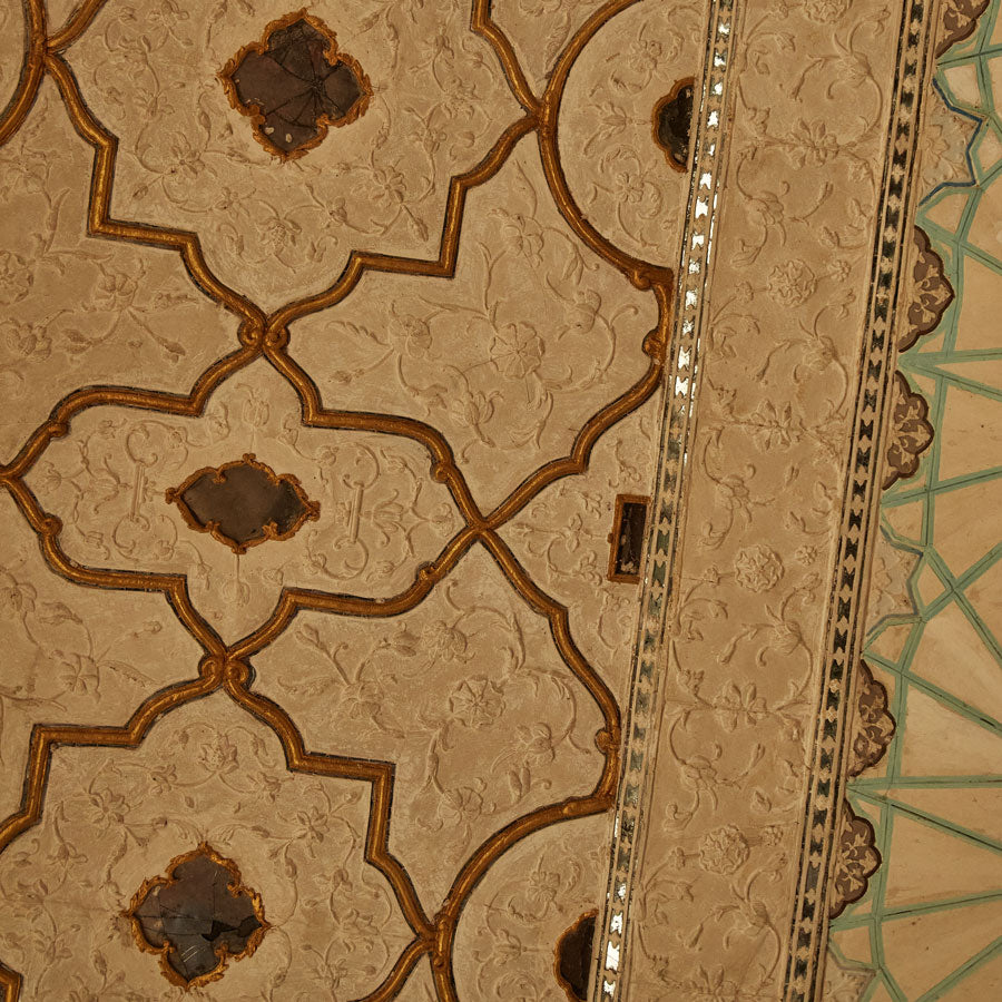 detailed hand-carved and hand-painted ceiling in building of India