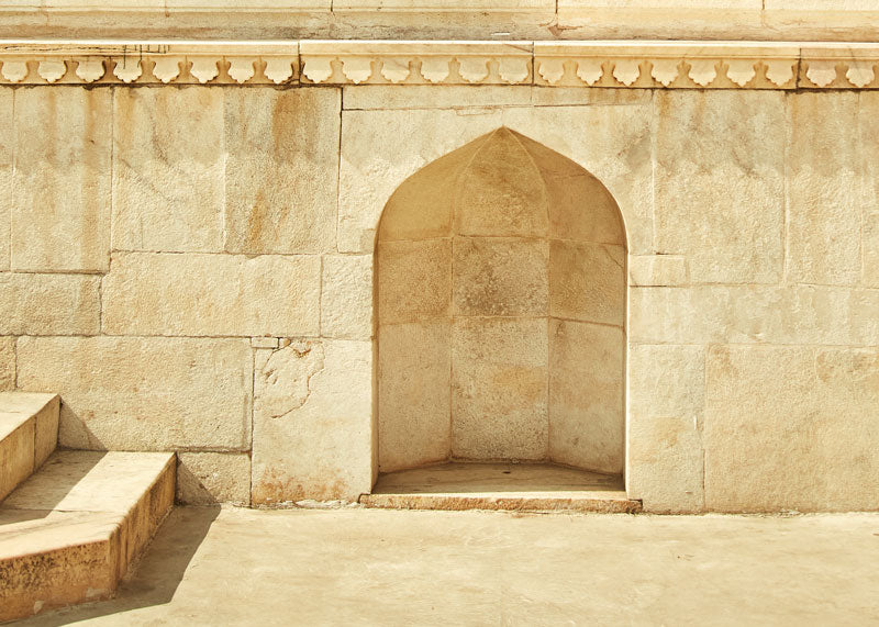 beautiful light tan curved stone archway on Indian building in Jaipur, India