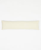 long lumbar pillow with interlock pattern on front and solid natural white backing made from organic cotton twill