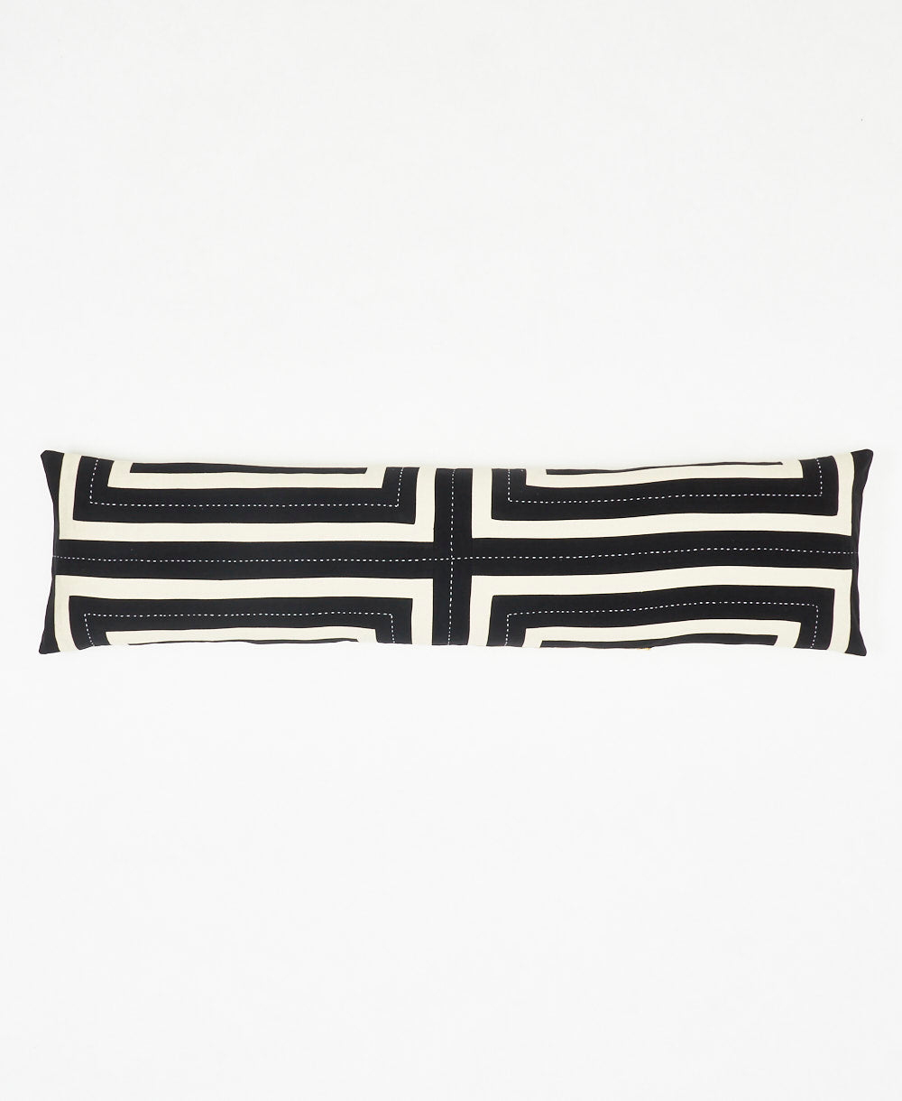 long lumbar pillow in black and white geometric pattern finishing with white embroidery