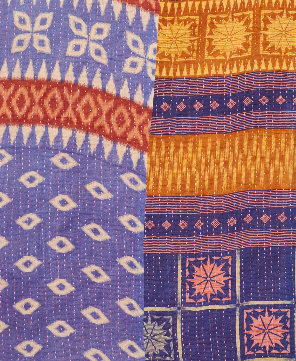 kantha quilt throw with a tag featuring the hand-stitched signature of the maker