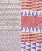 kantha quilt throw with a tag featuring the hand-stitched signature of the maker