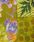 kantha quilt throw with a tag featuring the hand-stitched signature of the maker