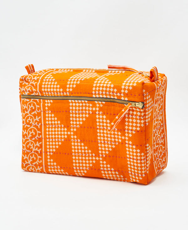 One-of-a-kind orange geometric kantha toiletry bag made
using recycled cotton saris