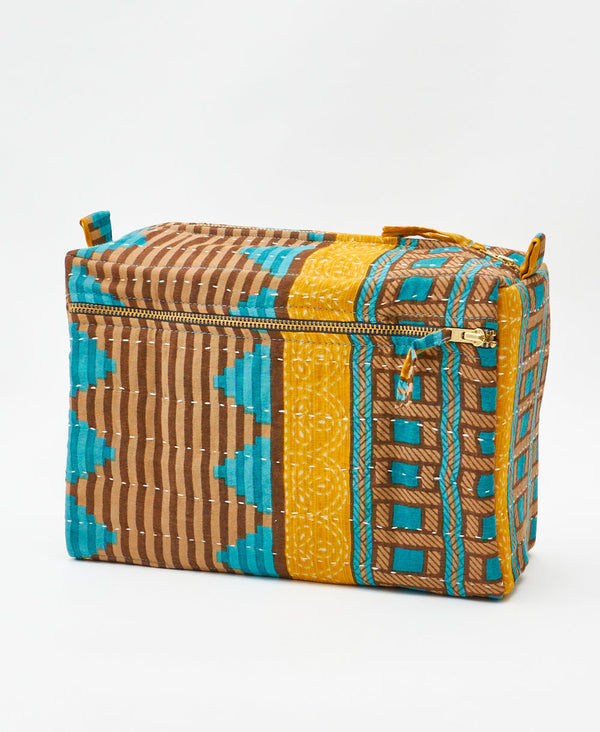 One-of-a-kind blue and brown striped kantha toiletry bag made
using recycled cotton saris