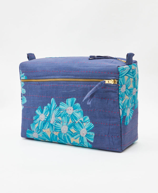 One-of-a-kind blue floral kantha toiletry bag made
using recycled cotton saris