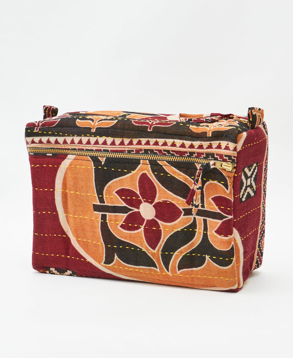 One-of-a-kind red and black floral kantha toiletry bag made
using recycled cotton saris