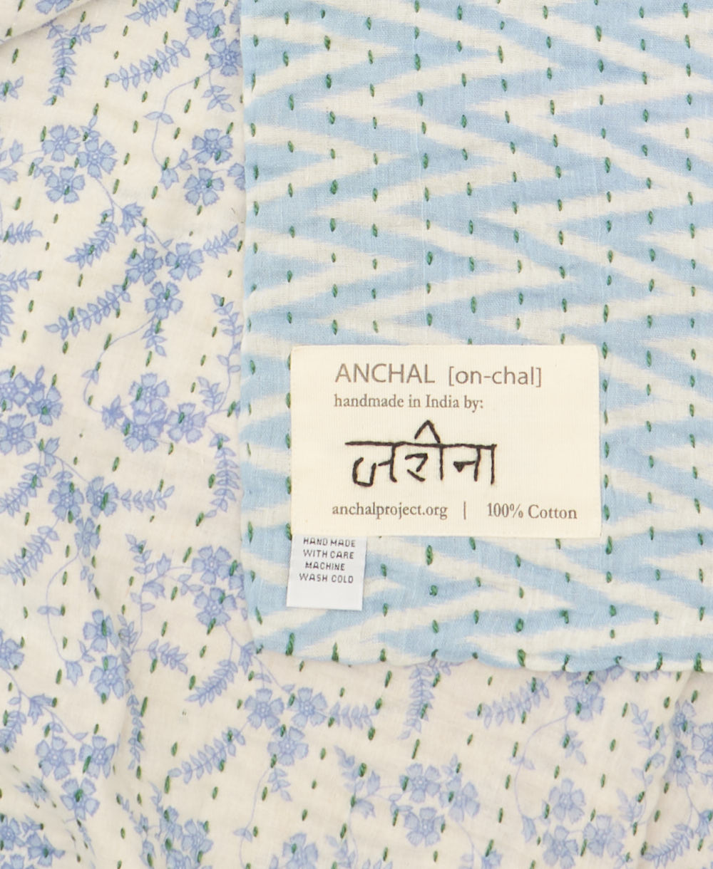 small kantha blanketwith signature of the maker on the tag