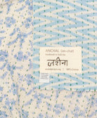small kantha blanketwith signature of the maker on the tag