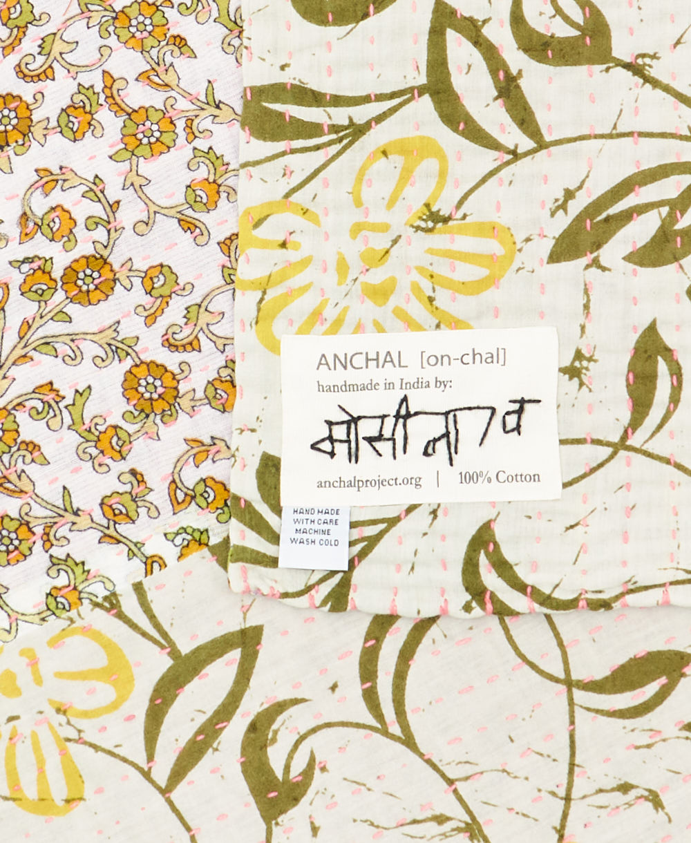 small kantha blanketwith signature of the maker on the tag