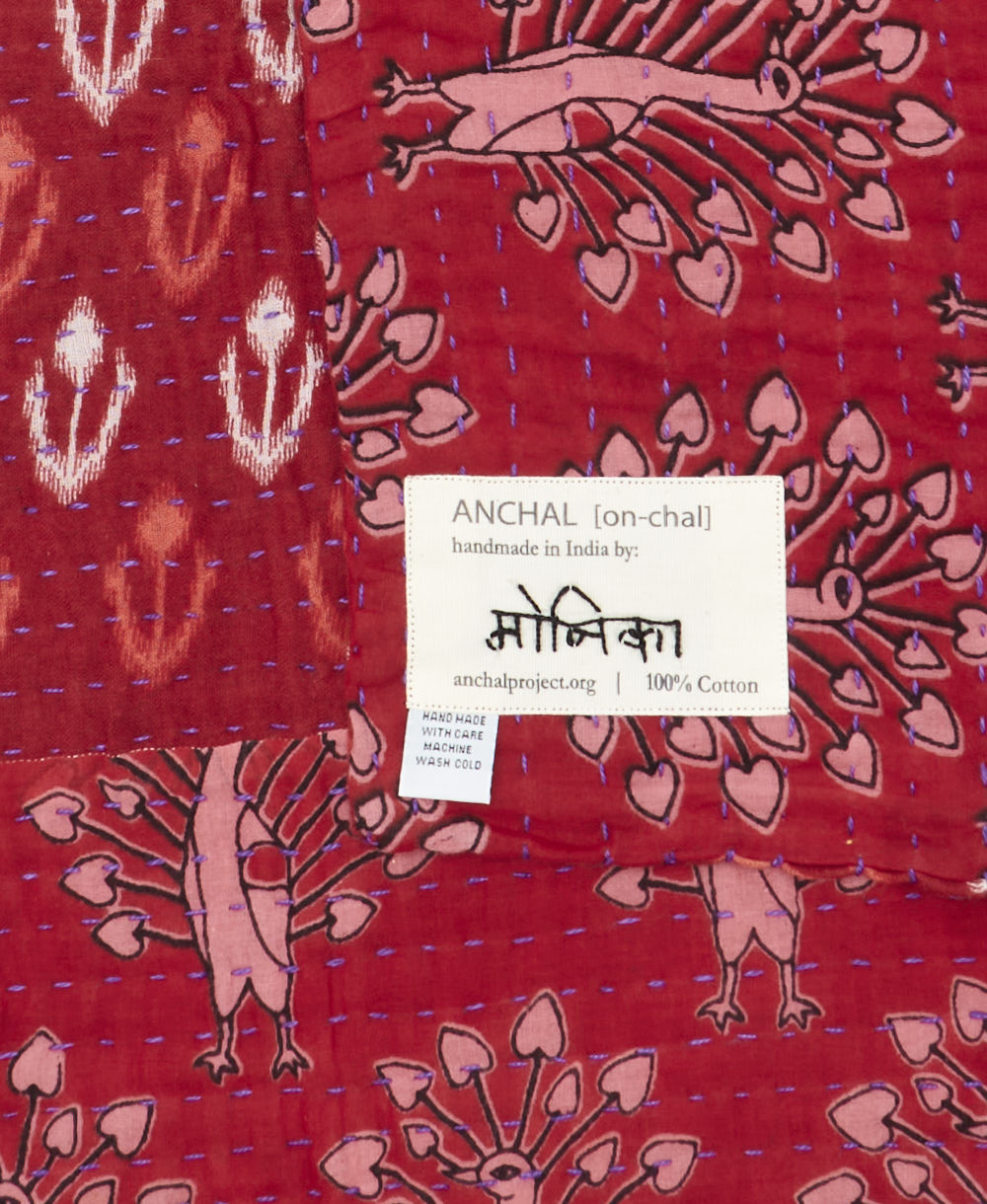 small kantha blanketwith signature of the maker on the tag