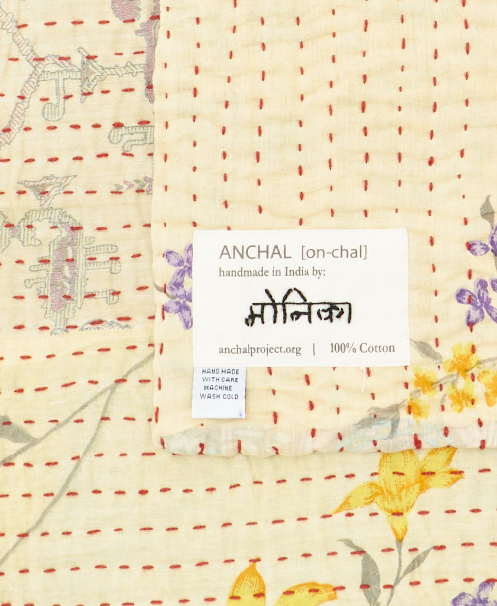 small kantha blanketwith signature of the maker on the tag