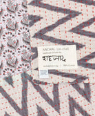 small kantha blanketwith signature of the maker on the tag