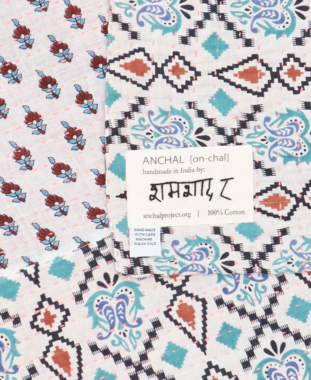 small kantha blanketwith signature of the maker on the tag