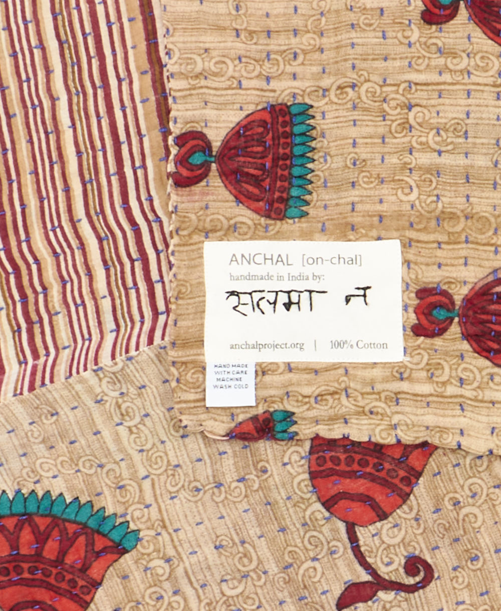 small kantha blanketwith signature of the maker on the tag