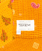 small kantha blanketwith signature of the maker on the tag