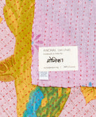 small kantha blanket with signature of the maker on the tag