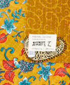 small kantha blanket with signature of the maker on the tag