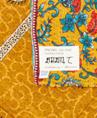 small kantha blanket with signature of the maker on the tag