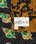 small kantha blanket with signature of the maker on the tag