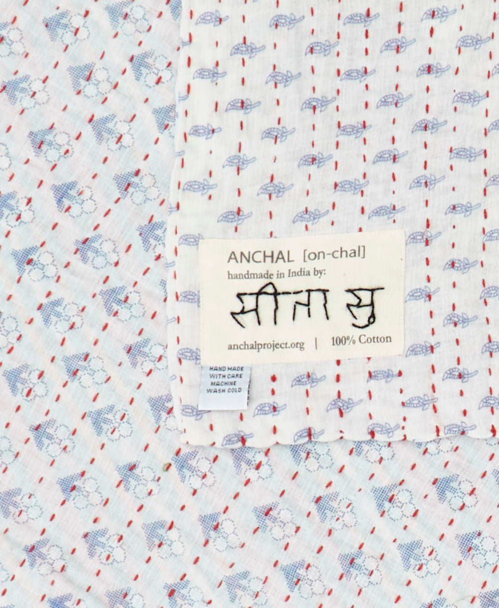 small kantha blanket with signature of the maker on the tag