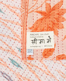 small kantha blanket with signature of the maker on the tag