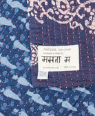 small kantha blanket with signature of the maker on the tag