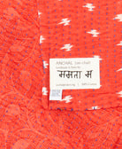 small kantha blanket with signature of the maker on the tag