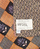 small kantha blanket with signature of the maker on the tag
