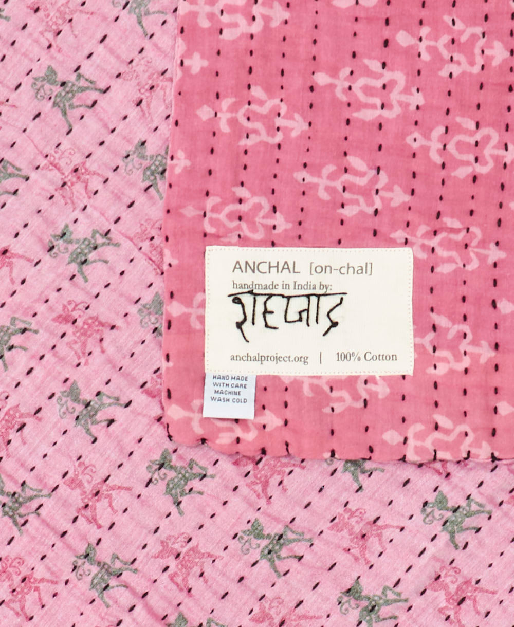 small kantha blanket with signature of the maker on the tag