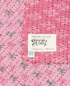 small kantha blanket with signature of the maker on the tag