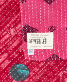 small kantha blanket with signature of the maker on the tag