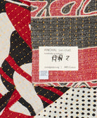small kantha blanket with signature of the maker on the tag