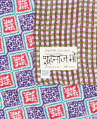 small kantha blanket with signature of the maker on the tag