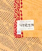 small kantha blanket with signature of the maker on the tag