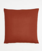 square pillow in rust red/burnt orange made from 100% organic cotton & low-impact dyes