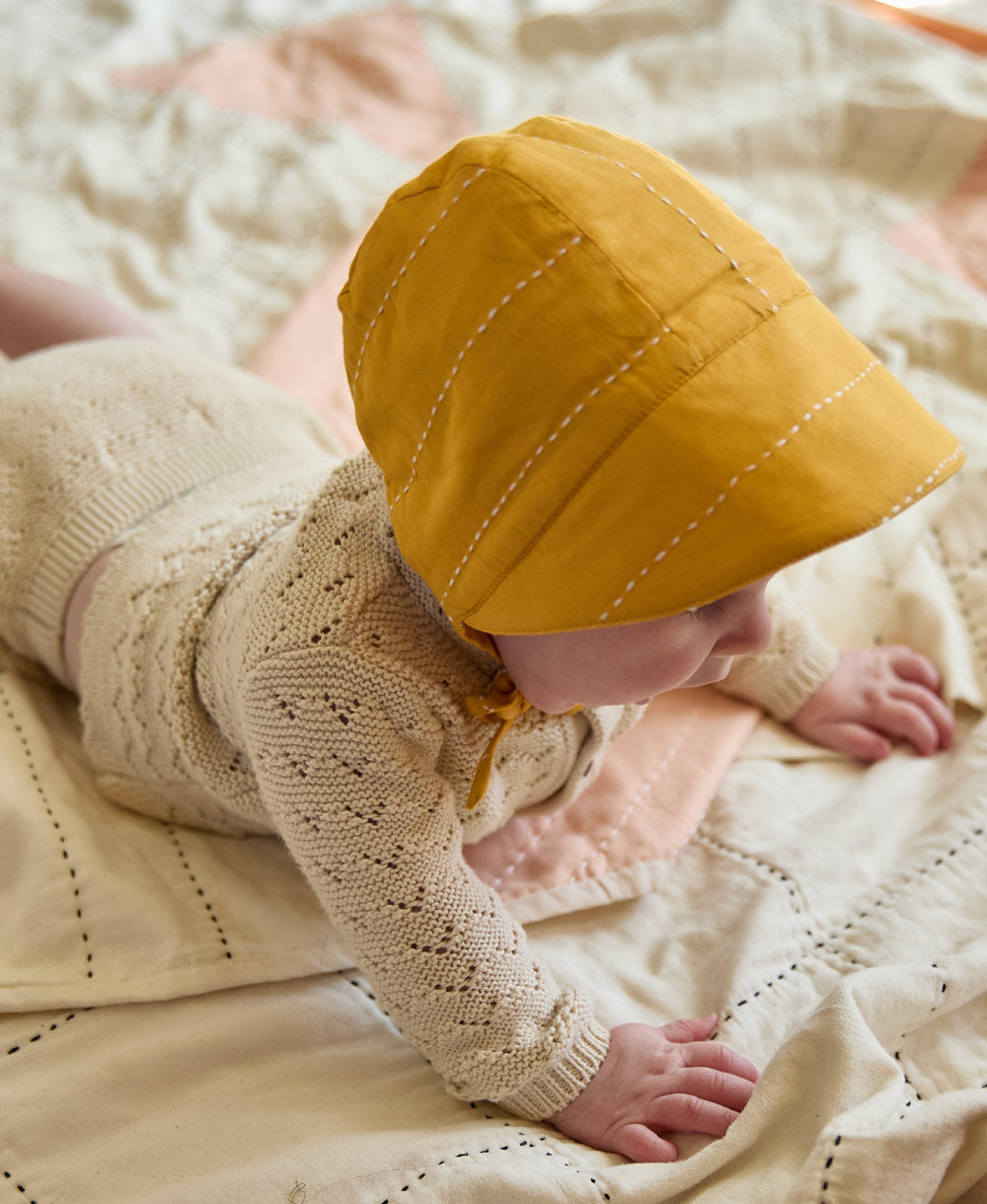 sustainable brimmed baby bonnet in mustard yellow handmade in India from organic cotton