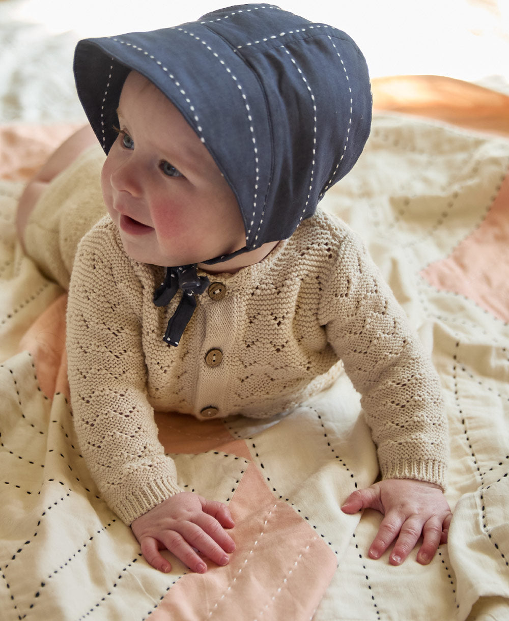 navy blue brimmed baby bonnet for newborns and babies made from organic cotton