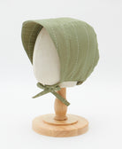 sage green brimmed baby bonnet with white kantha stitching made from organic cotton in India