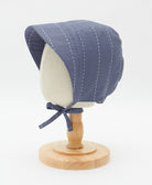 organic cotton brimmed bonnet in slate blue with white kantha stitching made from organic cotton by women in India