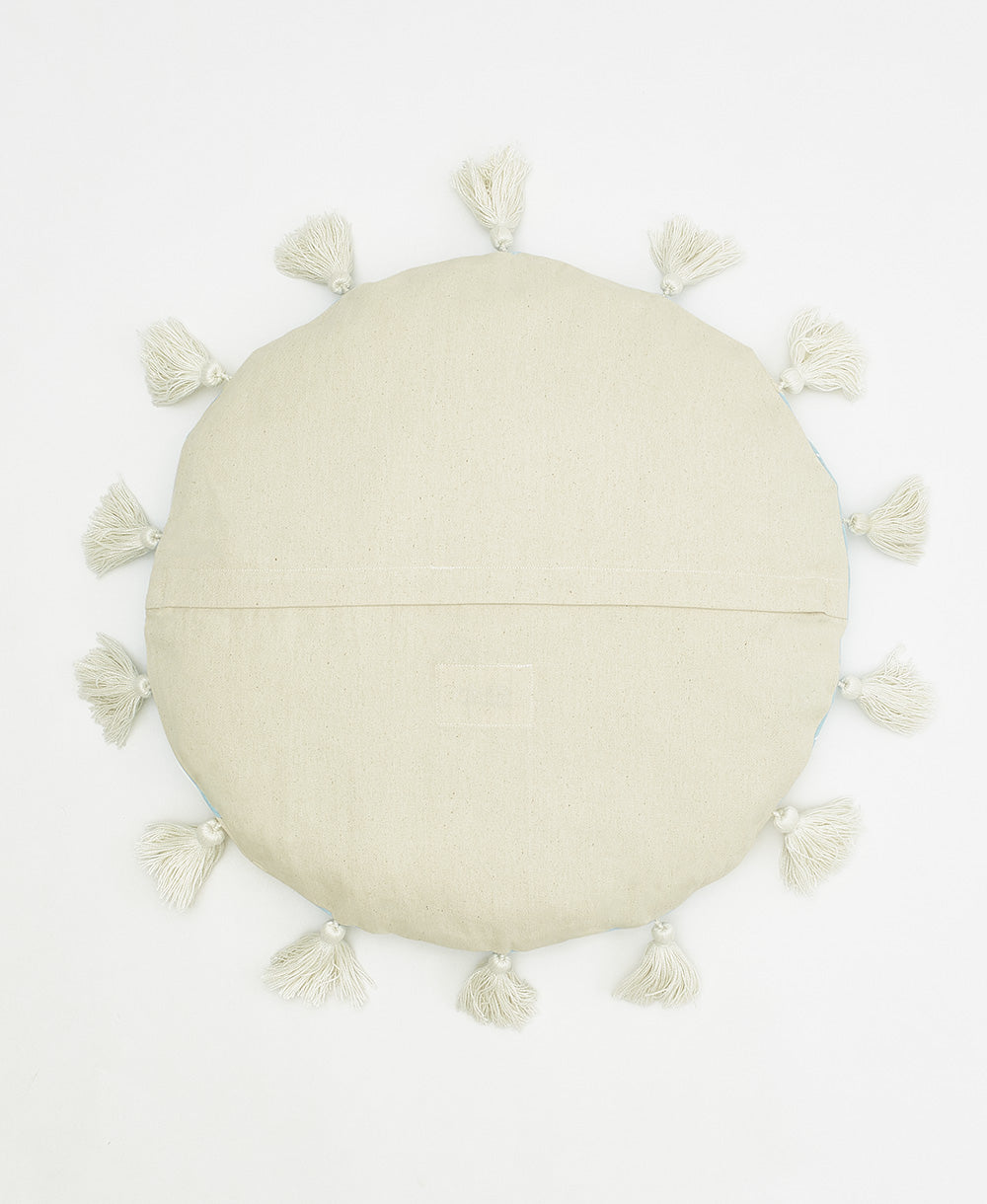 back of cabana stripe round pillow in cloud blue with white tassels and back zipper closure