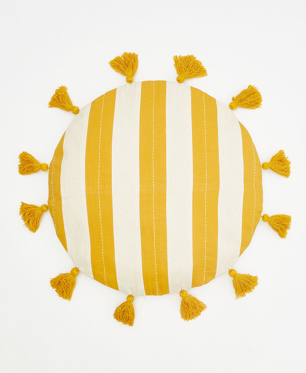 mustard yellow striped round pillow with yellow tassels handcrafted in India by women artisans