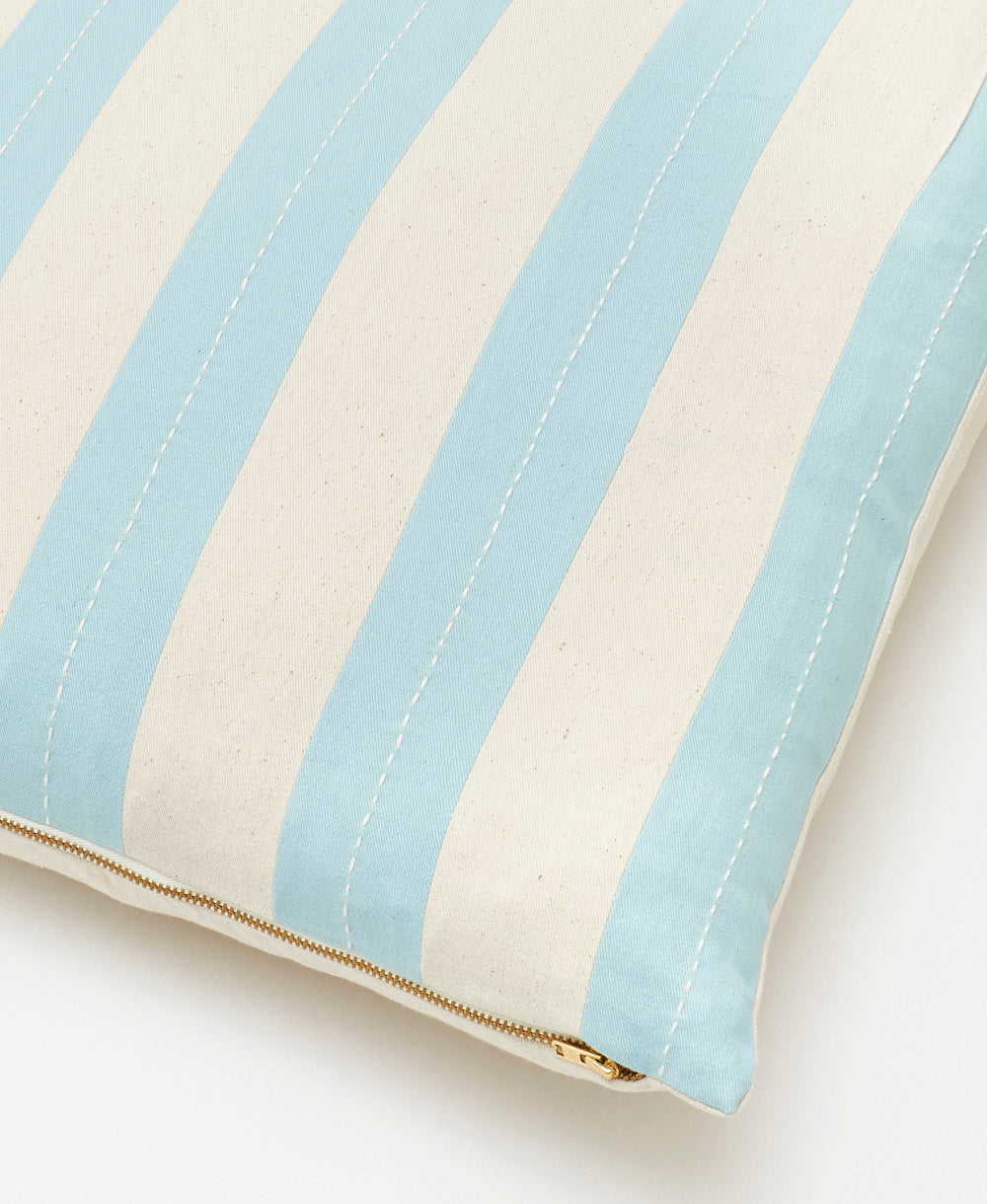 light blue striped throw pillow with white stitching, gold zipper & removable pillow insert